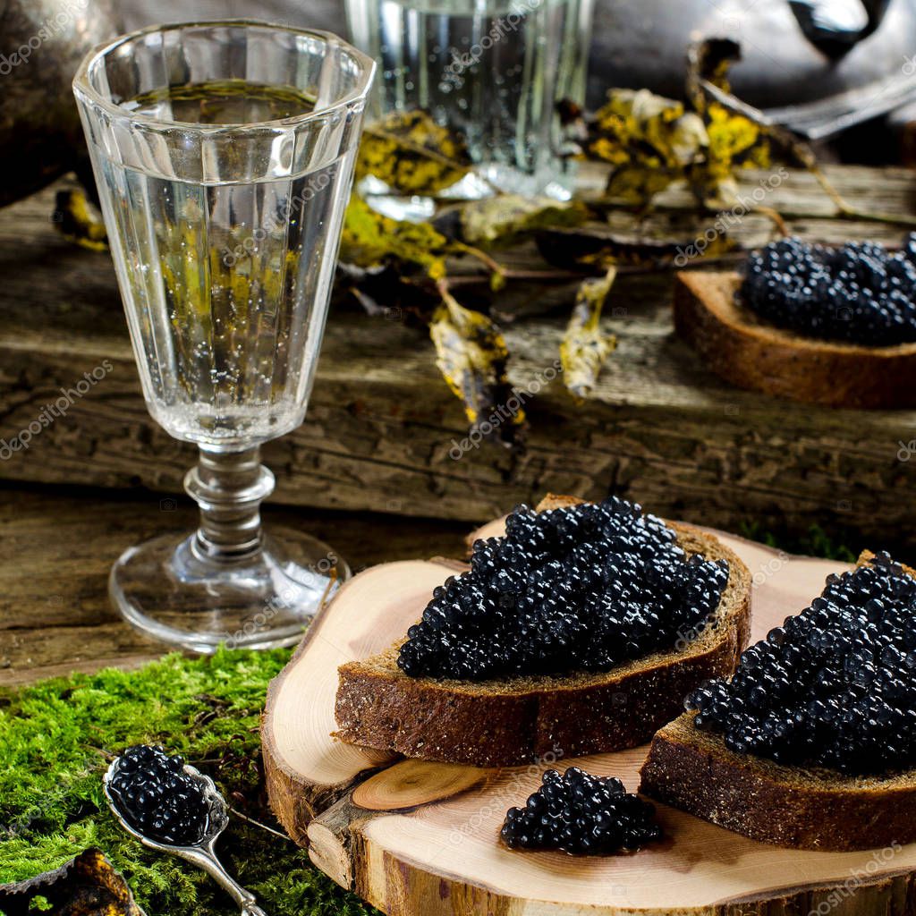 Black caviar and vodka. Vintage style. Stock Photo by &amp;copy;natalieina17  129590270