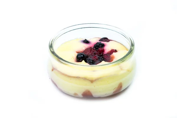 A fresh cream chantily with  blackberries, raspberries, and blueberries in a glass cup on a white background — Stock Photo, Image