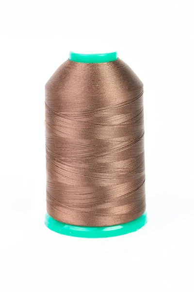 Brown spool of thread on white background — Stock Photo, Image