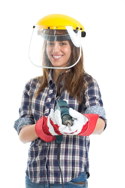 Atractiva mujer joven constructora con herramienta de perforación feliz por el buen trabajo. Aislado sobre fondo blanco . — Foto de Stock