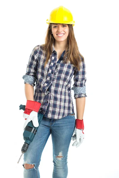 Construtor jovem atraente com ferramenta de broca feliz por um bom trabalho. Isolado sobre fundo branco . — Fotografia de Stock