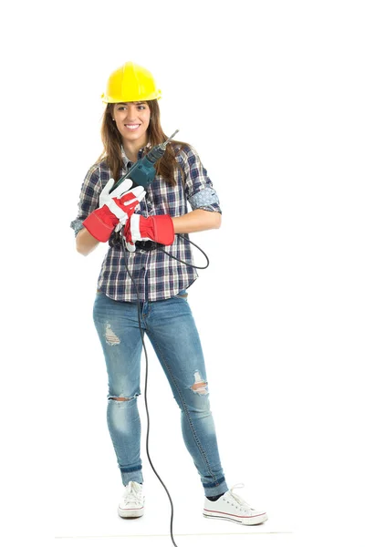 Приваблива молода жінка-будівельник з інструментом для свердління щаслива за хорошу роботу. Ізольовані на білому тлі . — стокове фото