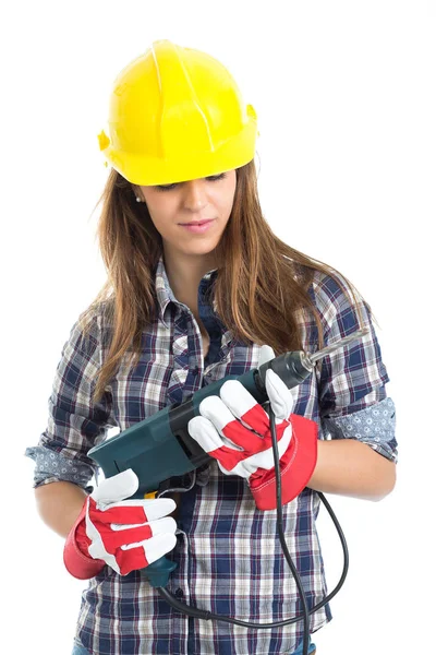 Construtor jovem atraente com ferramenta de broca feliz por um bom trabalho. Isolado sobre fundo branco . — Fotografia de Stock