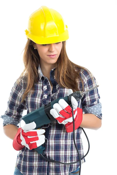 Приваблива молода жінка-будівельник з інструментом для свердління щаслива за хорошу роботу. Ізольовані на білому тлі . — стокове фото