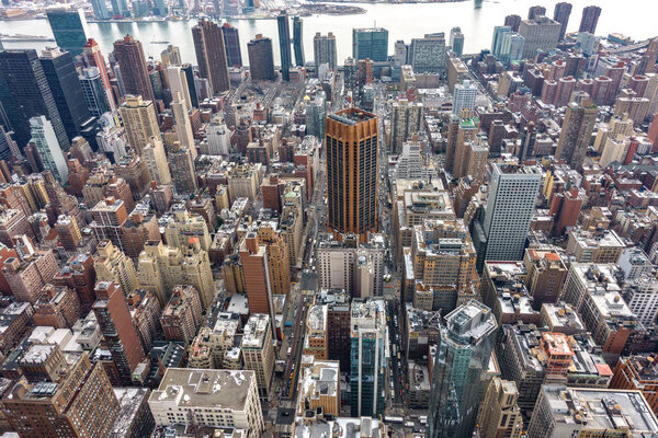 Aerial view of New York City Manhattan with skyscrapers and streets.