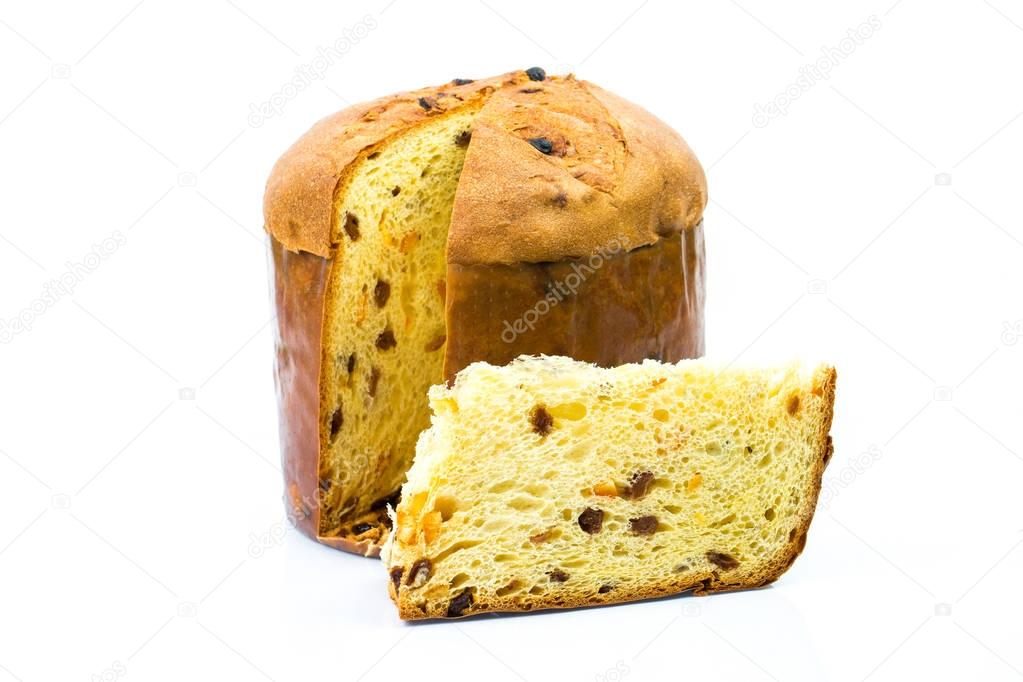 Classic panettone with dried fruit ,traditional Italian Christmas cake on white background. In front a sliced part of cake.
