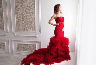 Beauty Brunette model woman in evening red dress. Beautiful fash clipart