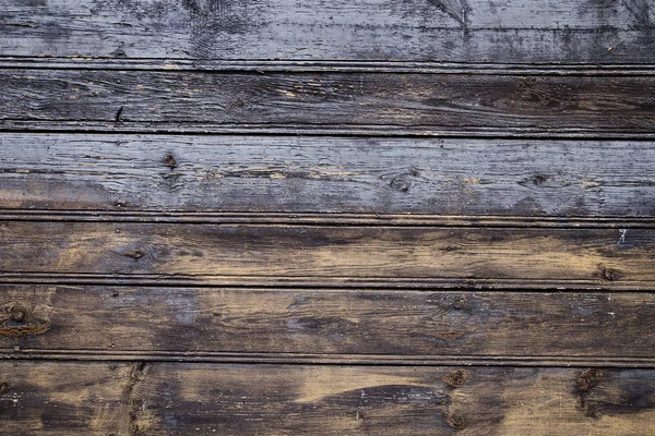 Старая деревянная стена с трещинами от краски — стоковое фото