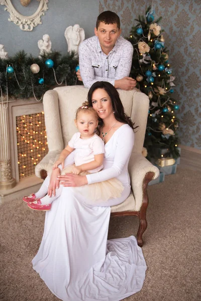 Beautiful family waiting for Christmas — Stock Photo, Image