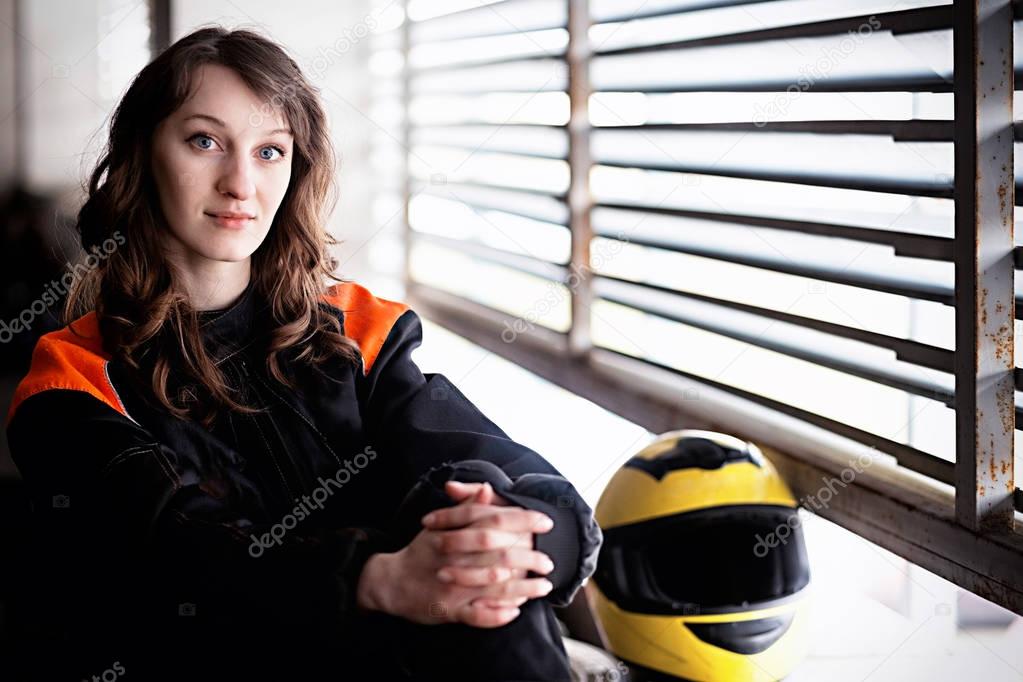 Young Vibrant Intense Girl with yellow Face Motorcycle Racing He