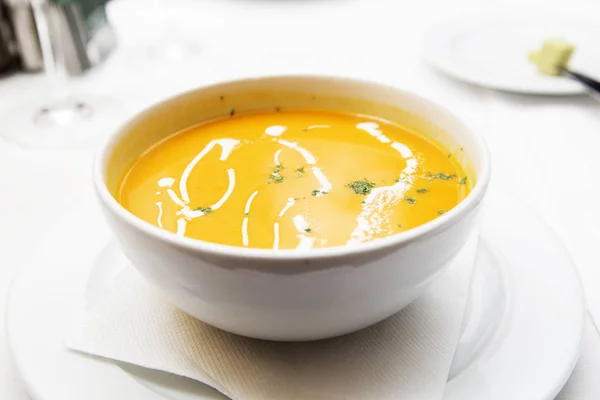 Pumpkin soup in a white plate — Stock Photo, Image