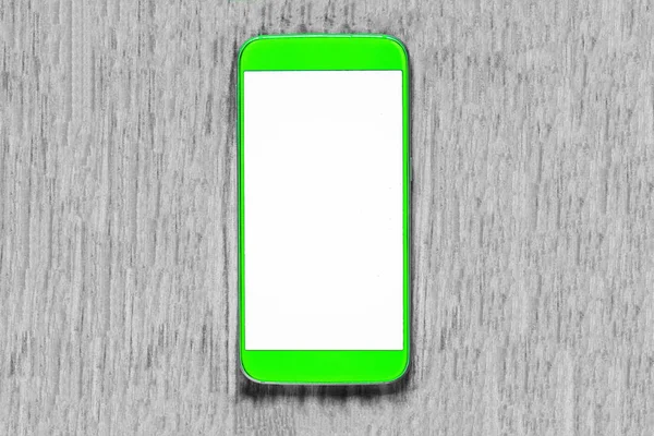 Ein Telefon auf dem Tisch mit weißem Bildschirm — Stockfoto