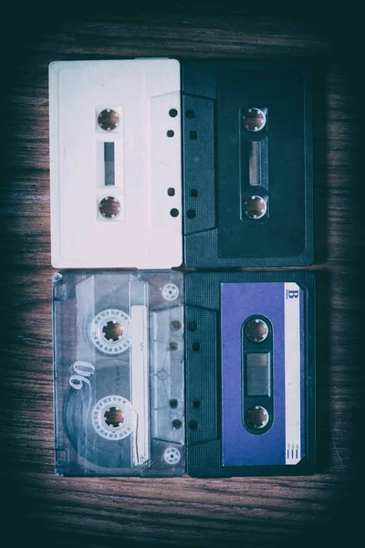 Old cassette tapes with a wooden background — Stock Photo, Image