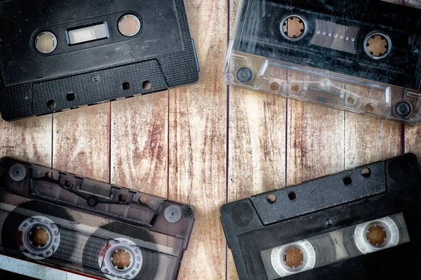 Old cassette tapes with a wooden background — Stock Photo, Image