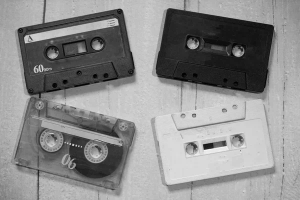 Old cassette tapes with a wooden background — Stock Photo, Image