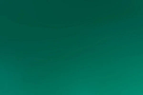 Um fundo abstrato de uma cor verde — Fotografia de Stock