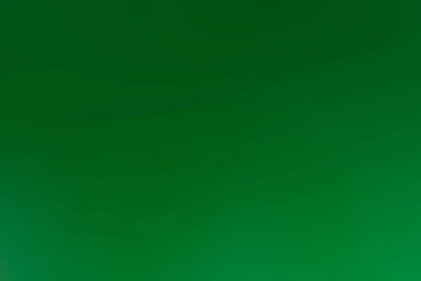 Um fundo abstrato de uma cor verde — Fotografia de Stock