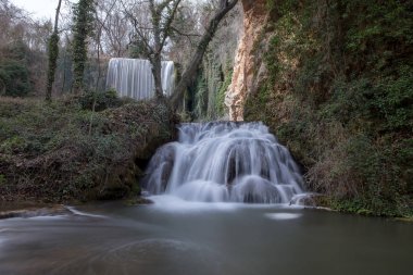 Waterfall in the stone monastery in Aragon clipart