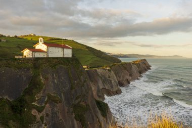 The hermitage of San Telmo at dawn by the sea clipart