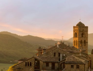 A sunrise in the town of Ainsa in Huesca, Spain clipart