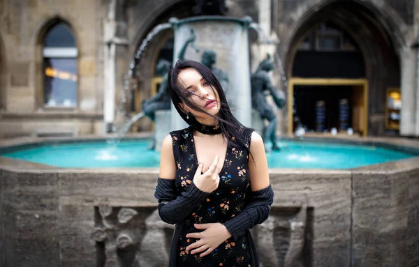 Beautiful girl portrait on the street in black dress — Stock Photo, Image