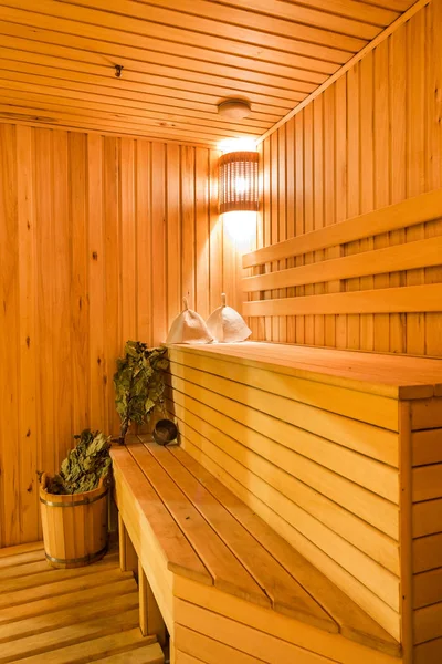 Interior of a sauna. Advantage for health. Oak brooms for a steam room in traditional russian wooden bath. — Stock Image Interior of a sauna. Advantage for health. Oak brooms for a steam room in traditional russian wooden bath. Stock Image