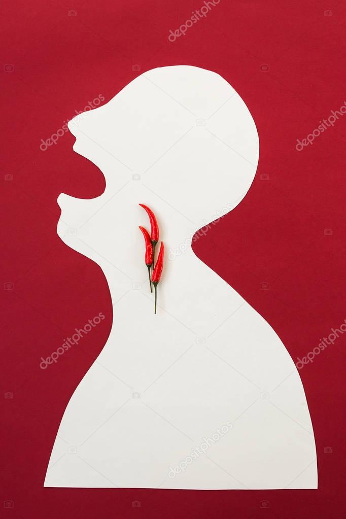 concept of human disease, suffering and stinging pain, thrills - abstract white male man isolated on a red background screaming open mouth, many severe pain in throat, burning pain so hot like chilli.