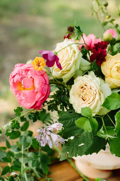 wedding, floral design, applied art, decoration, summer concept - fresh bunch of beautiful blossoms: tender avalanches, english roses, big blooming peony and red dianthuses