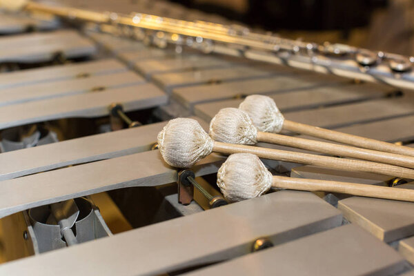 xylophone, music and chromatic instrument concept - close seup on wooden bars with four mallets, glockenspiel, marimba, balafon, semantron, pixiphone, education and orchestra concert usage
.