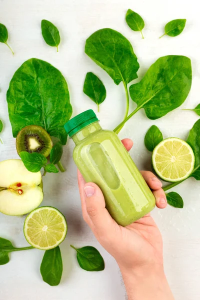 Vertical Frame Man Hand Pick Bottle Green Detox Beverage White — Stock Photo, Image