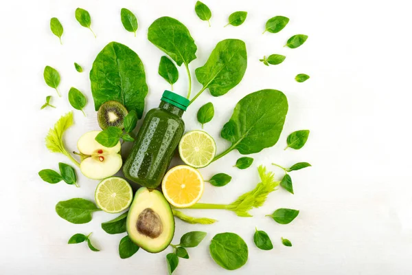 Creative Composition Several Bottles Green Smoothies White Background Occlusion Stems — Stock Photo, Image