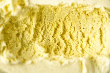 Vanilyalı dondurma arka plan scooped. Yaz gıda kavramı, kopya alanı, üstten görünüm. Tatlı yoğurt tatlı veya sarı dondurma doku.