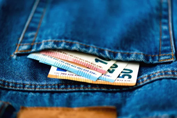 Euro banknotes in jeans pocket. Success, wealth and poverty, poorness concept. Euro currency background with copy space. — Stock Photo, Image