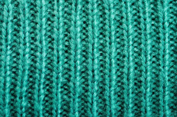 Örme doku. Yünden kumaş. Turkuaz arka plan, kopya alanı