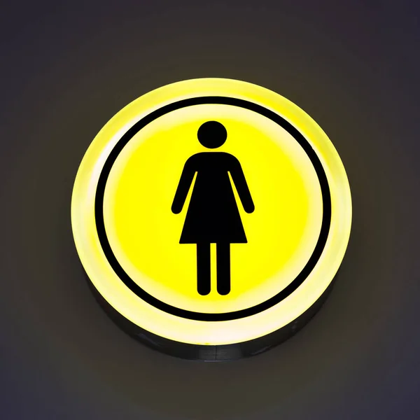 Toilet female signs on the abstract wall background. Copy space. Woman gender concept, feminism. — Stock Photo, Image