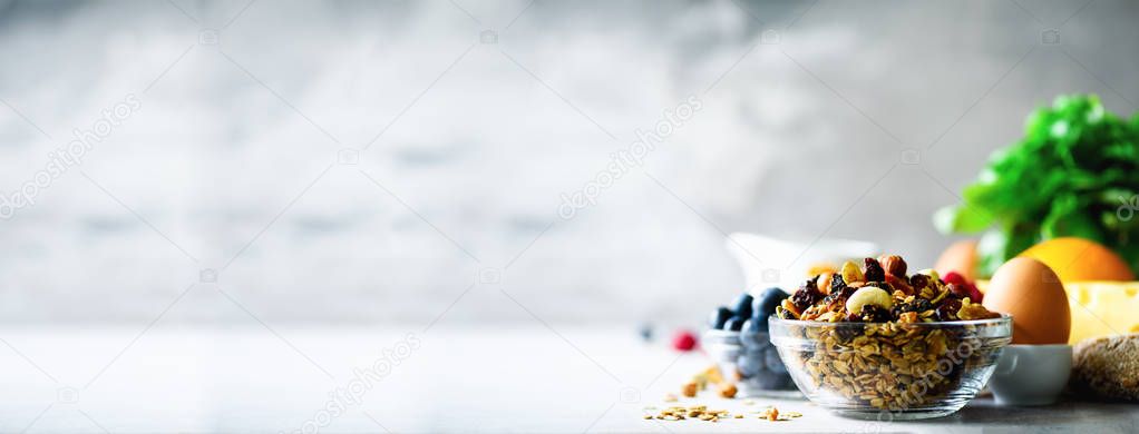 Homemade granola with milk, fresh berries, milk for breakfast. Copy space. Healthy breakfast concept. Banner