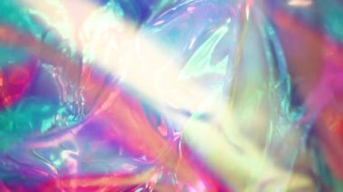 Holografik yanardöner yüzey. Parlak renkli hologram geçmişi. Birden fazla renkle buruşmuş soyut doku. Neon yüzeyi.