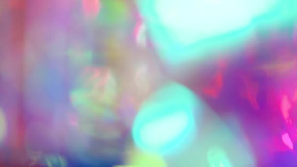 Multicolored motion gradient background. Blurred bokeh background of holiday lights. Festive greeting card. Colorful pattern wallpaper. Festive texture. — Stock Video