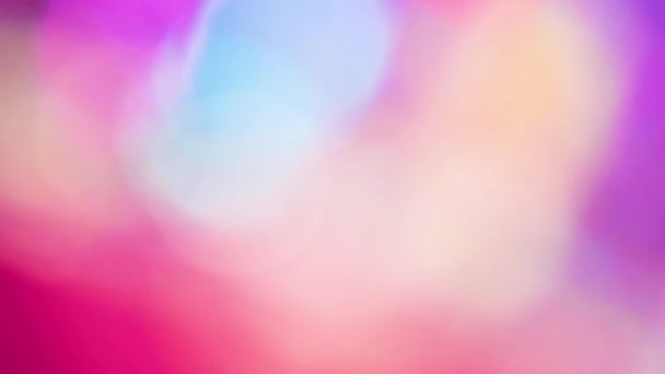 Multicolored motion gradient background. Blurred bokeh background of holiday lights. Festive greeting card. Colorful pattern wallpaper. Festive texture. — 비디오