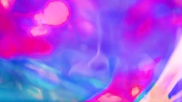 Holographic iridescent surface. Bright colorful hologram background. Wrinkled abstract texture with multiple colors. Neon surface. — Stock Video