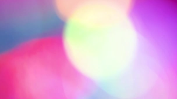 Multicolored motion gradient background. Blurred bokeh background of holiday lights. Festive greeting card. Colorful pattern wallpaper. Festive texture. — 비디오