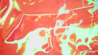 Holografik yanardöner yüzey. Parlak renkli hologram geçmişi. Birden fazla renkle buruşmuş soyut doku. Neon yüzeyi.