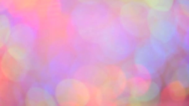 Multicolored motion gradient background. Blurred bokeh background of holiday lights. Festive greeting card. Colorful pattern wallpaper. Festive texture. — Stock Video