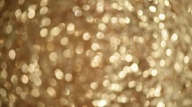 Parlak soyut desenli arka plan altın ışıklarla, bokeh. Noel, yeni yıl konsepti. Şenlikli altın fon