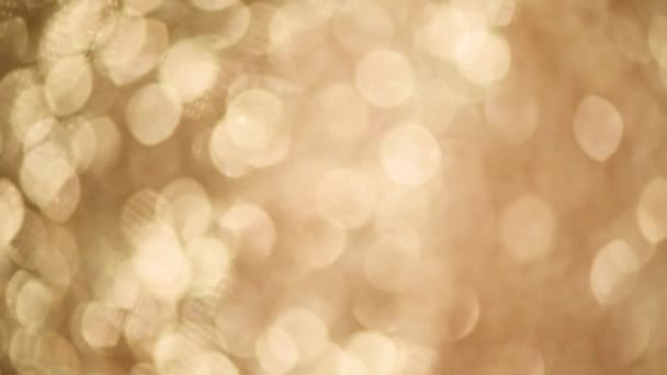 Fond doré brillant pour les salutations de Noël. Bannière avec lumières déconcentrées, bokeh jaune vif. Shimmer of gold glitter texture. Concept de Nouvel An, vacances de luxe .