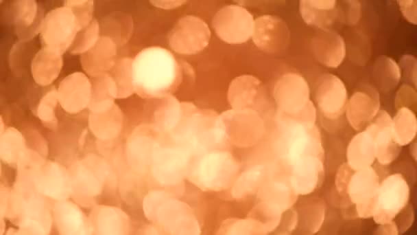 Fond scintillant scintillant. Texture abstraite vacances. Carte de Noël avec bokeh doré, lumières déconcentrées . — Video