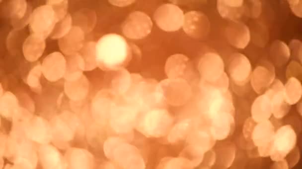 Funkeln glitzernden Hintergrund. Urlaub abstrakte Textur. Weihnachtskarte mit Gold-Bokeh, defokussierte Lichter. — Stockvideo