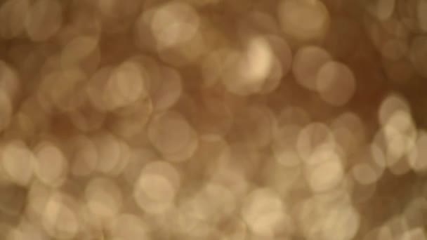 Brilho de fundo brilhante. Férias textura abstrata. Cartão de Natal com bokeh ouro, luzes desfocadas . — Vídeo de Stock