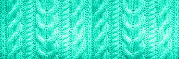 Knitted texture. Pattern fabric made of wool in mint color. Background, copy space. Trendy green and turquoise color. — Stock Photo, Image