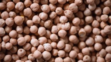 Arkaplanda çiğ organik kurutulmuş nohut dokusu. Vejetaryen sağlıklı beslenme. Üst görünüm, kopyalama alanı, sağlıklı yaşam tarzı konsepti.